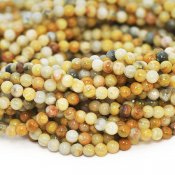 Små runda pärlor av naturlig Crazy Lace agat, ca 3mm